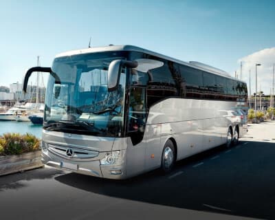 Silver Mercedes-Benz Tourismo coach at the harbour