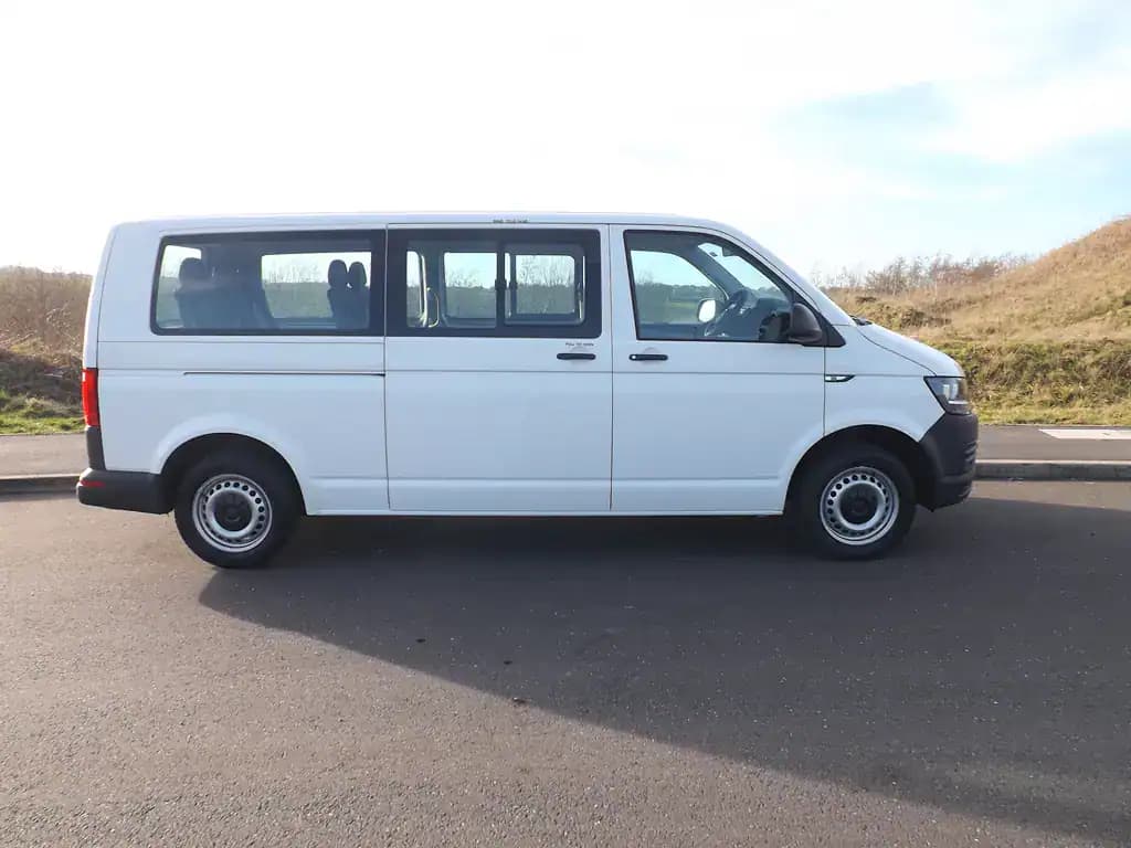 White Volkswagen Transporter passenger minibus side view